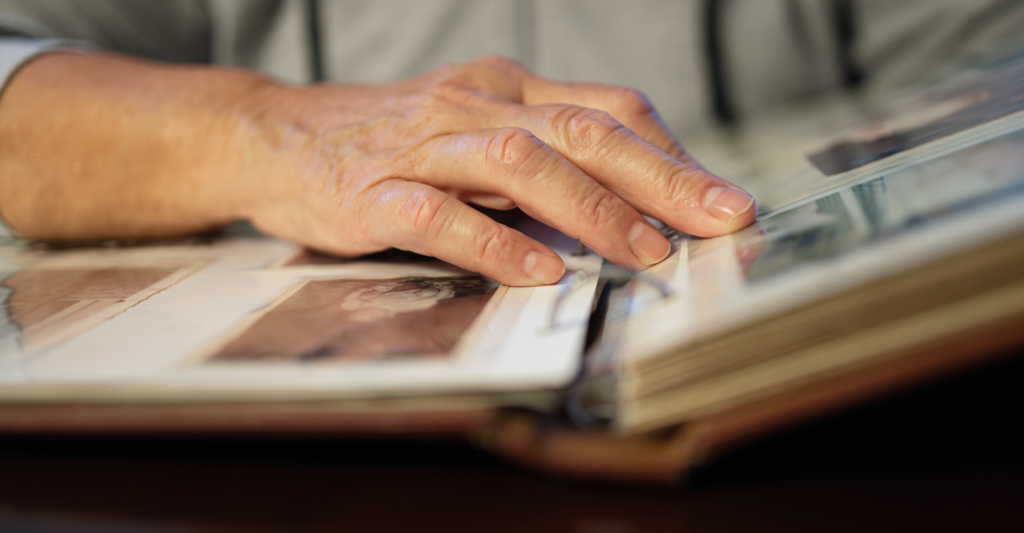 Rising generation , man's hands on photo album, generational, history, family, inheritance