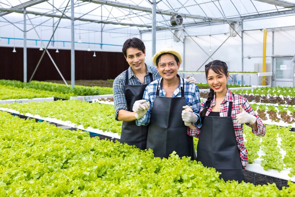 Families of Wealth, photo of an ethnic family in a greenhouse, growing, proud, family business