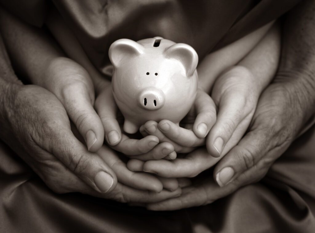 Philanthropy, multiple hands holding piggy bank, family, generational, wealth, parents, guidance, understanding wealth